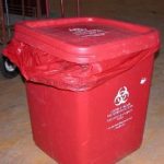 improperly secured waste container with the bag drooping outside the can