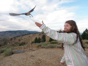 student participating in raptor release
