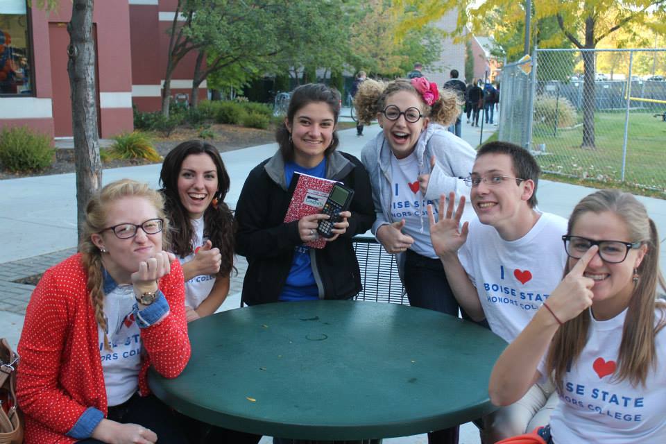 Group of students posing with nerdy faces with T-shirts that read 'I (heart) Boise State Honors College