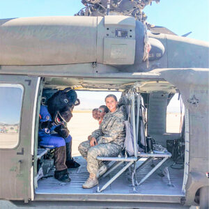 Buster Bronco in a helicopter with Boise State Military Students