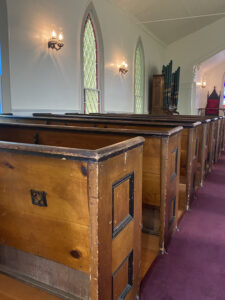 Rows of wodden pews in Christ Chapel