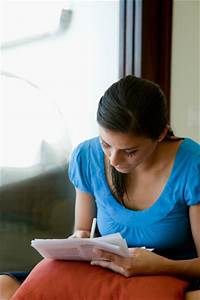 Woman writing on paper