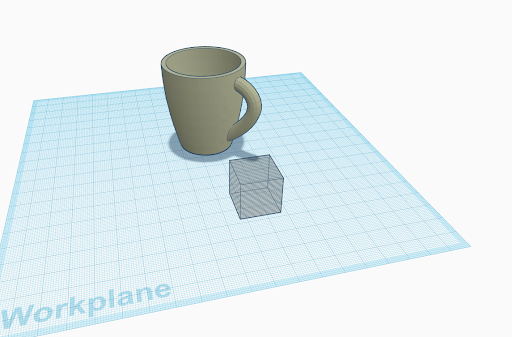 Mug and transparent cube in work plane