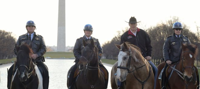 Photo of Secretary of Interior Ryan Zinke arriving for his first day of work on horseback. ior.