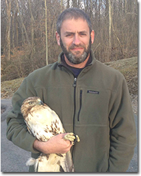 Todd Katzner with bird in hand