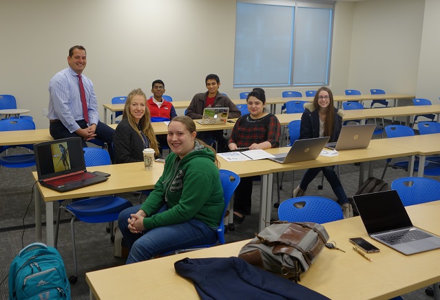 Five Boise State Computer Science graduate and undergraduate students and two other people