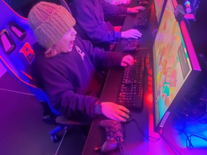 Image of a student playing a game on a computer at Boise State's ESport's center.