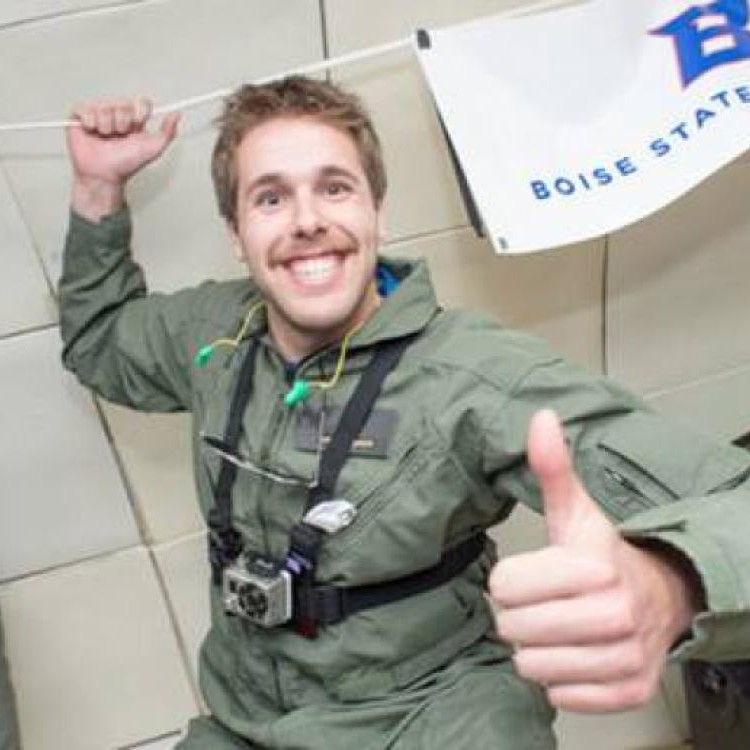 Microgravity Team member gives a thumbs up