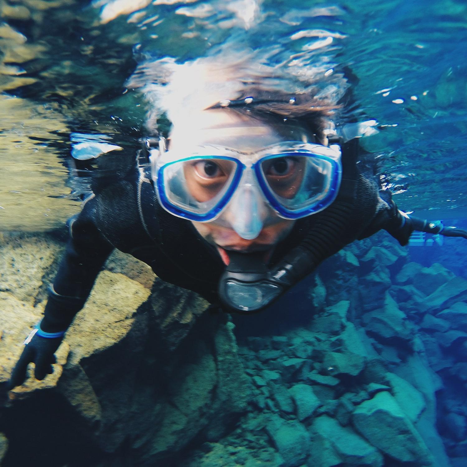 Male student snorkeling in Iceland