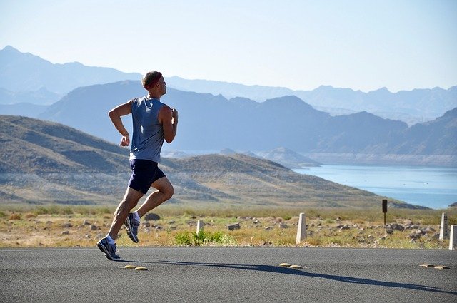 male runner on a scenic road