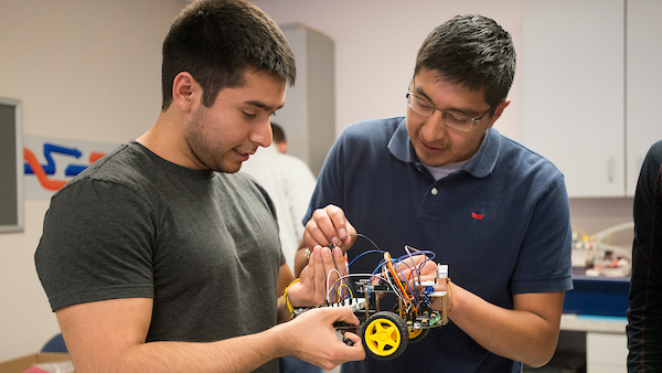 Student and professor working on mechatronics project