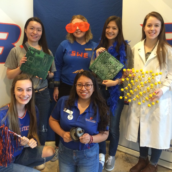 six female students show off engineering props