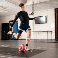 test subject kicking soccer ball