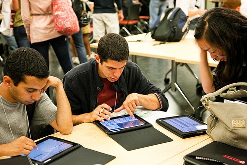 students working on tablet computers