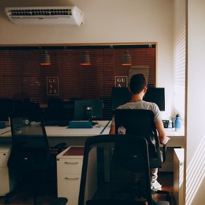 a man working in an air conditioned office