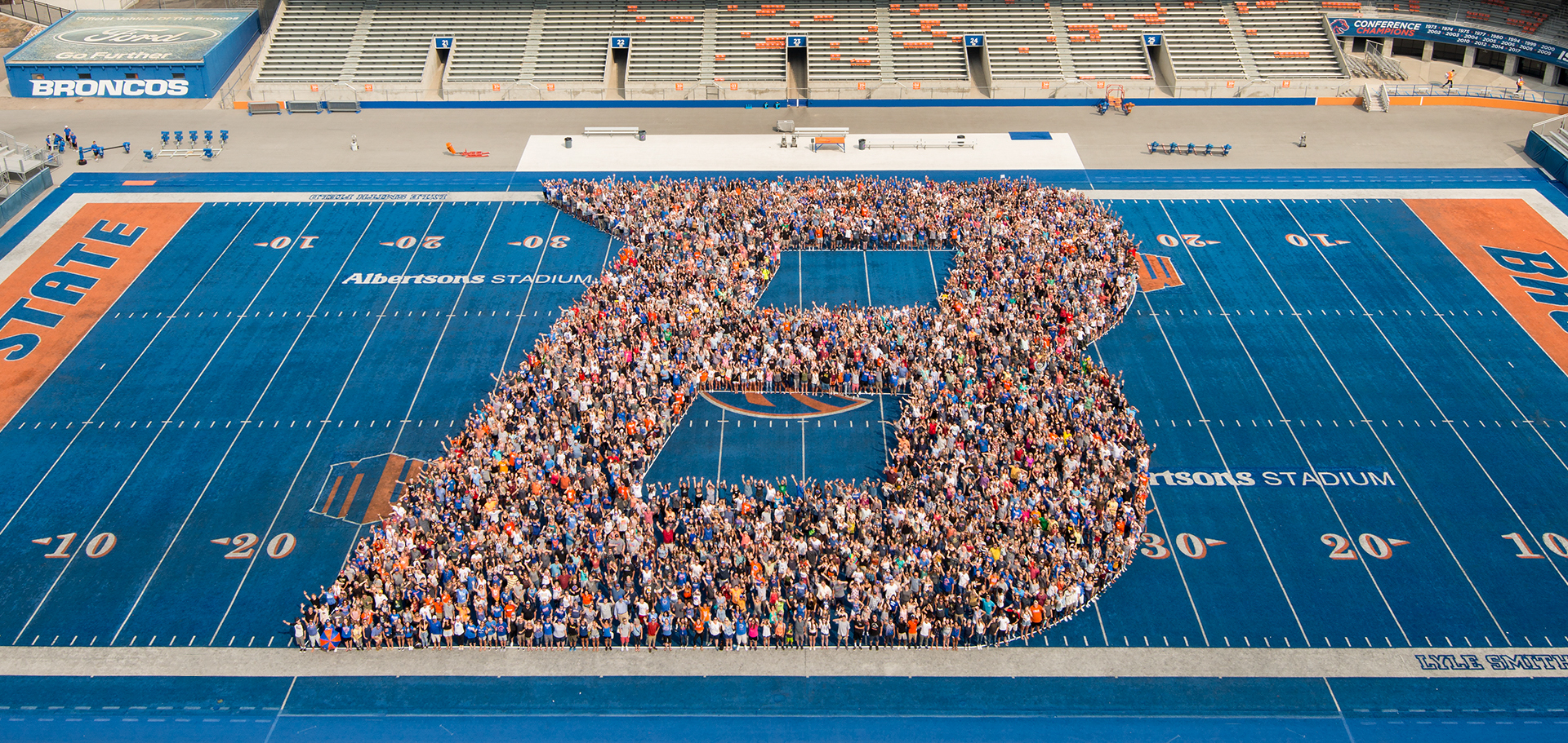 Students organized in the shape of a B on the Boise State football field