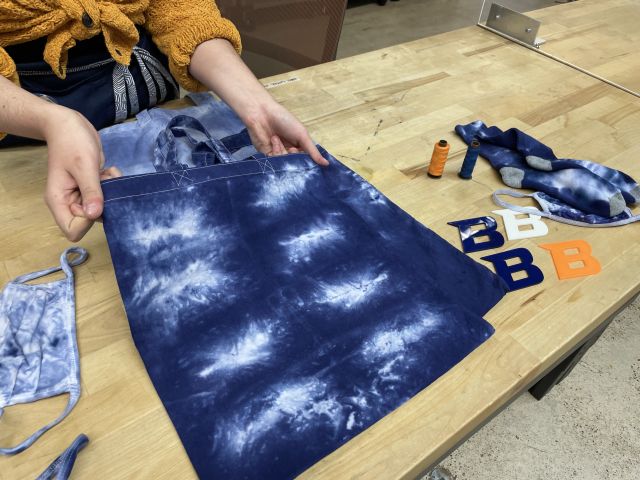 Color photo of a cloth bag that's been tie dyed white and blue