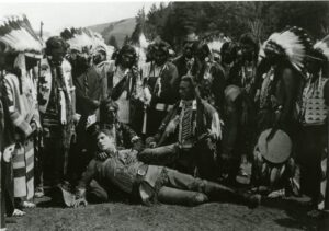 Members of the Nez Perce and actor Robert Warwick on the set of Told in the Hills (1919)