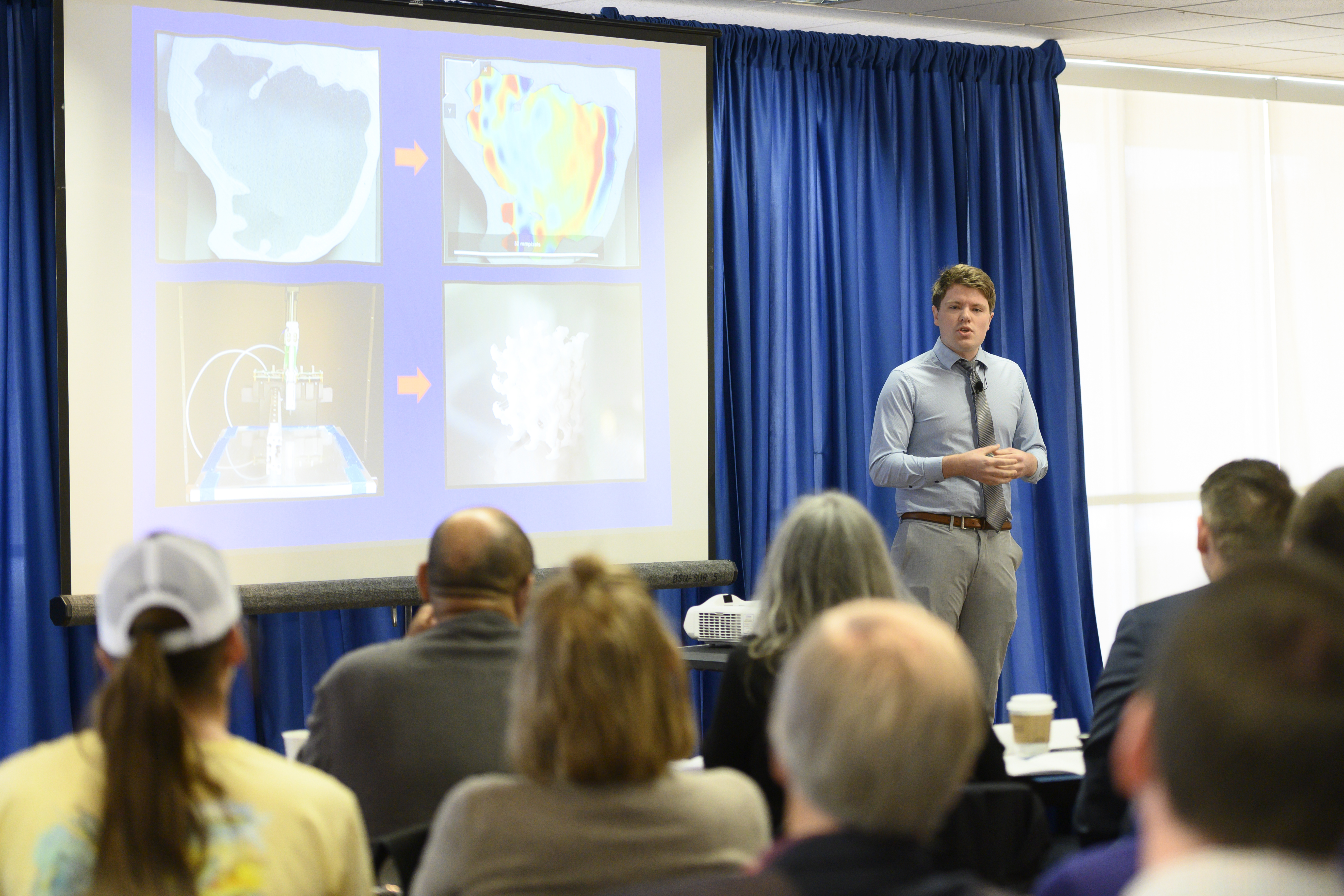 photo of Alexander Regner presenting at the 3MT