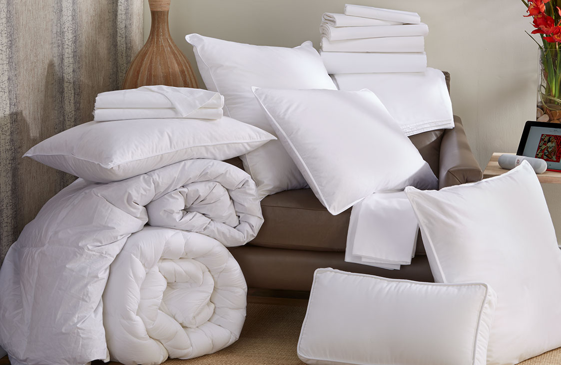 white pillows and linens