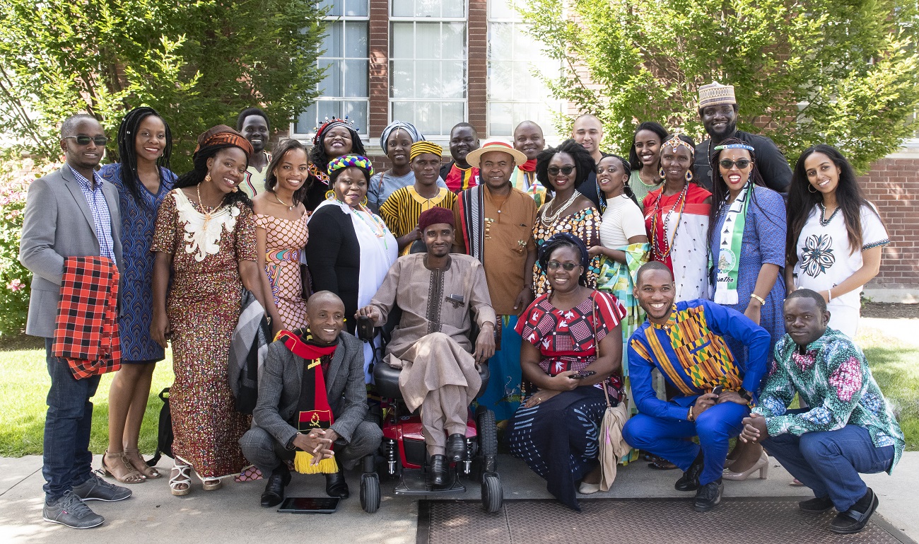 Group photo of 25 Africans in traditional attire