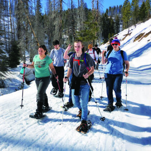 Students out snowshoeing in the mountains
