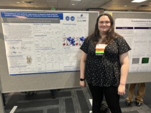 Photo of Christina Fischer standing in front of her research poster
