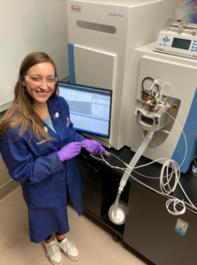 Photo of Graduate student Rachel Reichow working with equipment in the Callahan lab