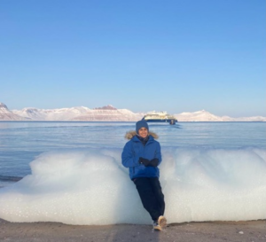 Rosemary Eufemio sitting on an ice bank