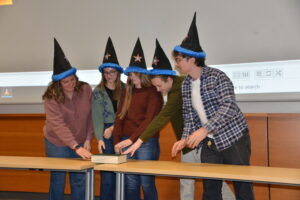 Kenzie Ballinger, Ally Bonnifield, Katie Devereaux, Seamus Jude and Gabe Miles taking the "wizard pledge" at the Wizard Hat Ceremony