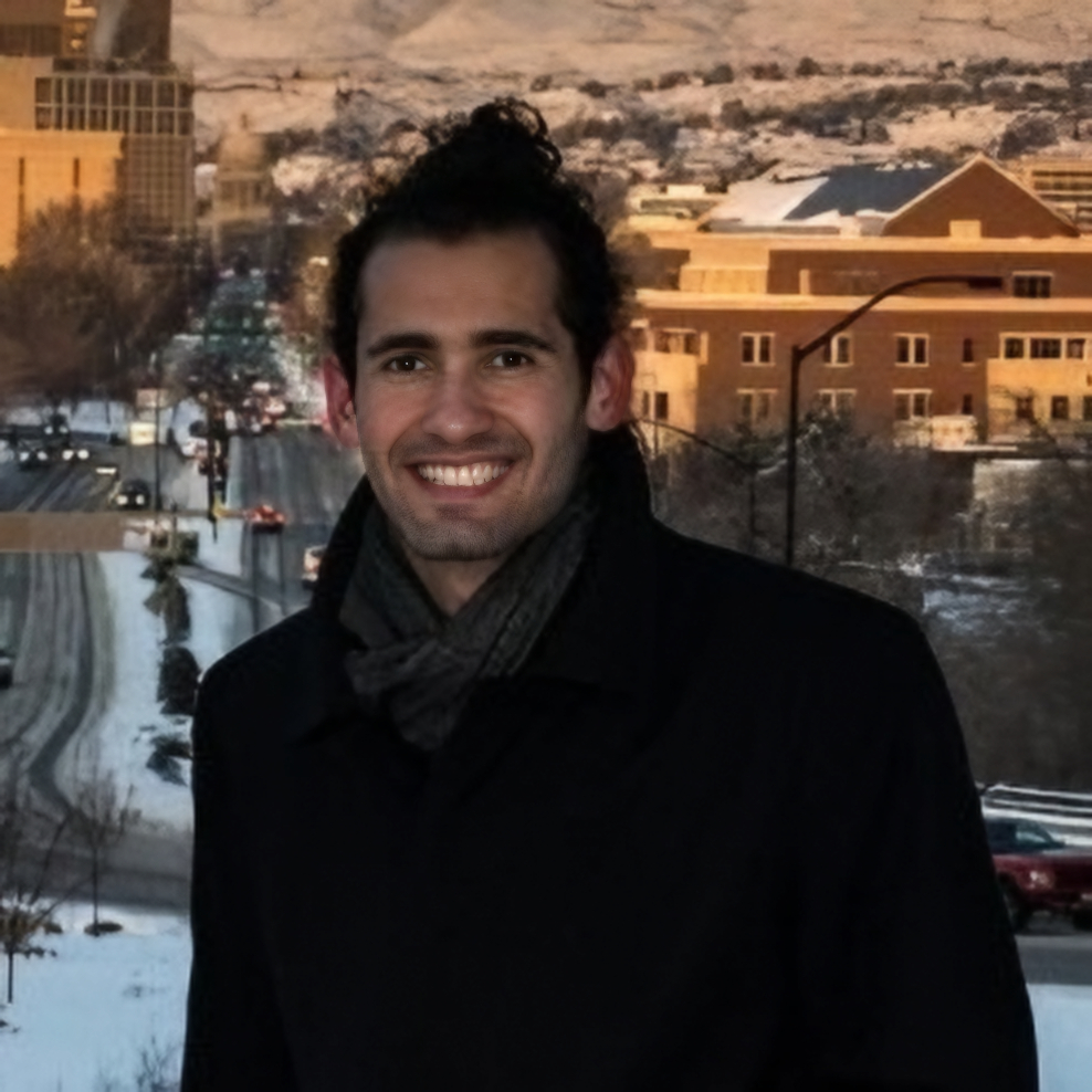 Photo of Thiago da Silva on a hill with snowy downtown Boise in the background
