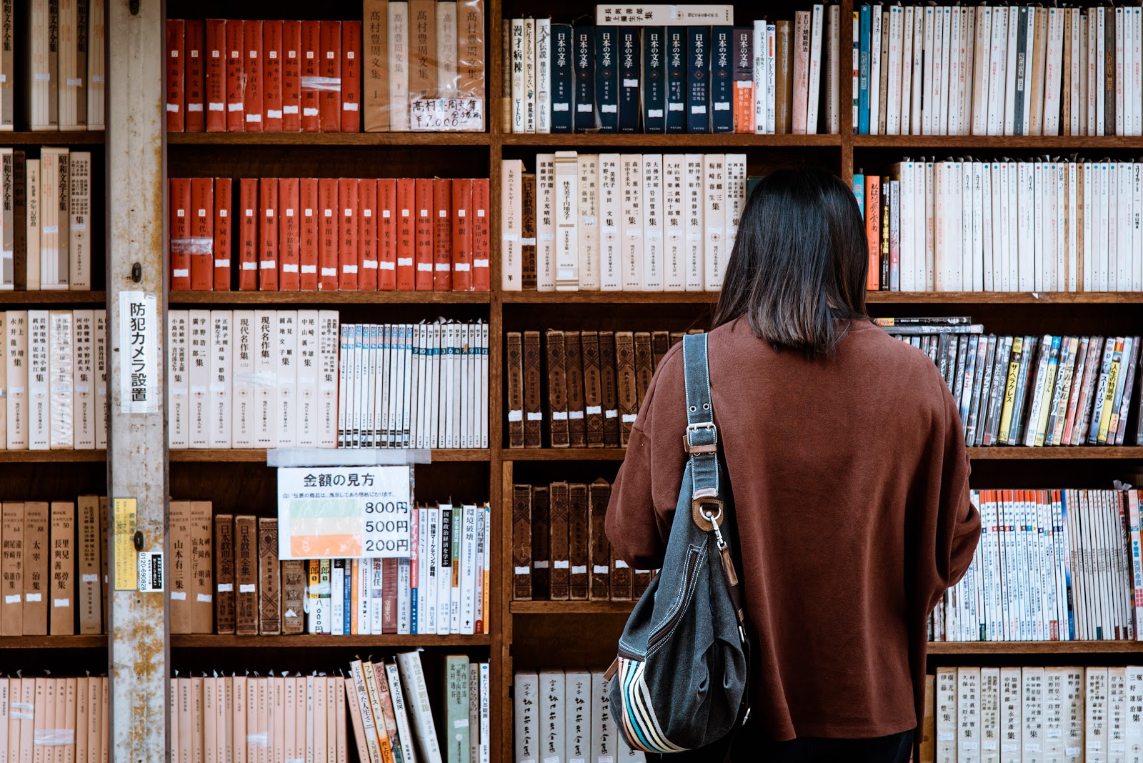 Woman in front of library books