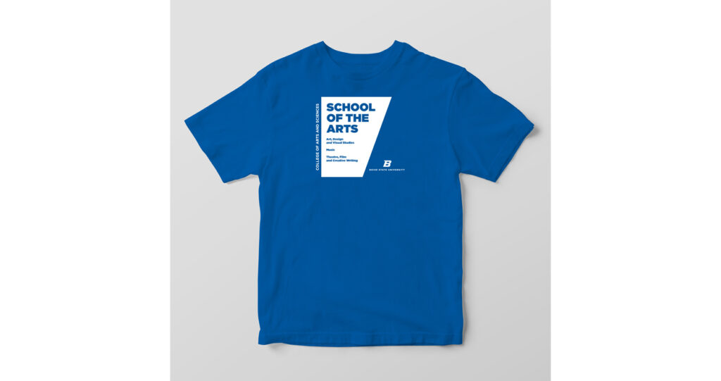 An image of a blue T-shirt with white angled rectangle promoting the School of the Arts.