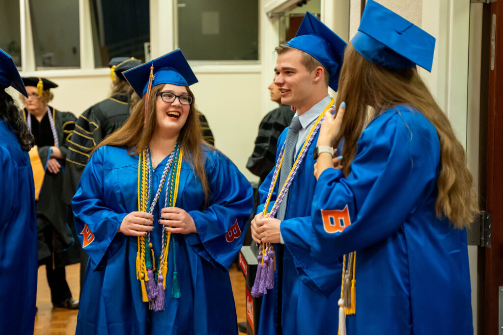 BSN Graduates Laugh as they line up for the processional.