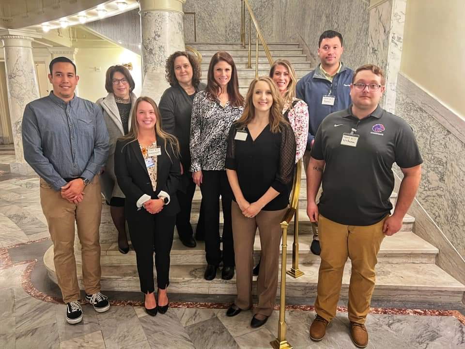 A group of nursing students pose for a picture together inside the Idaho State Capitol.