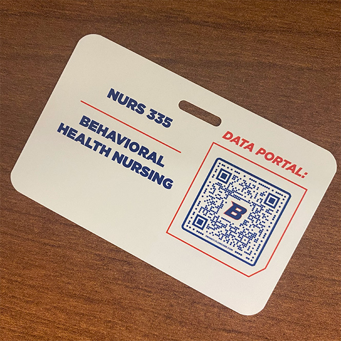 Image of a badge with a QR code for NURS 335: Behavioral Health Nursing Data Portal.