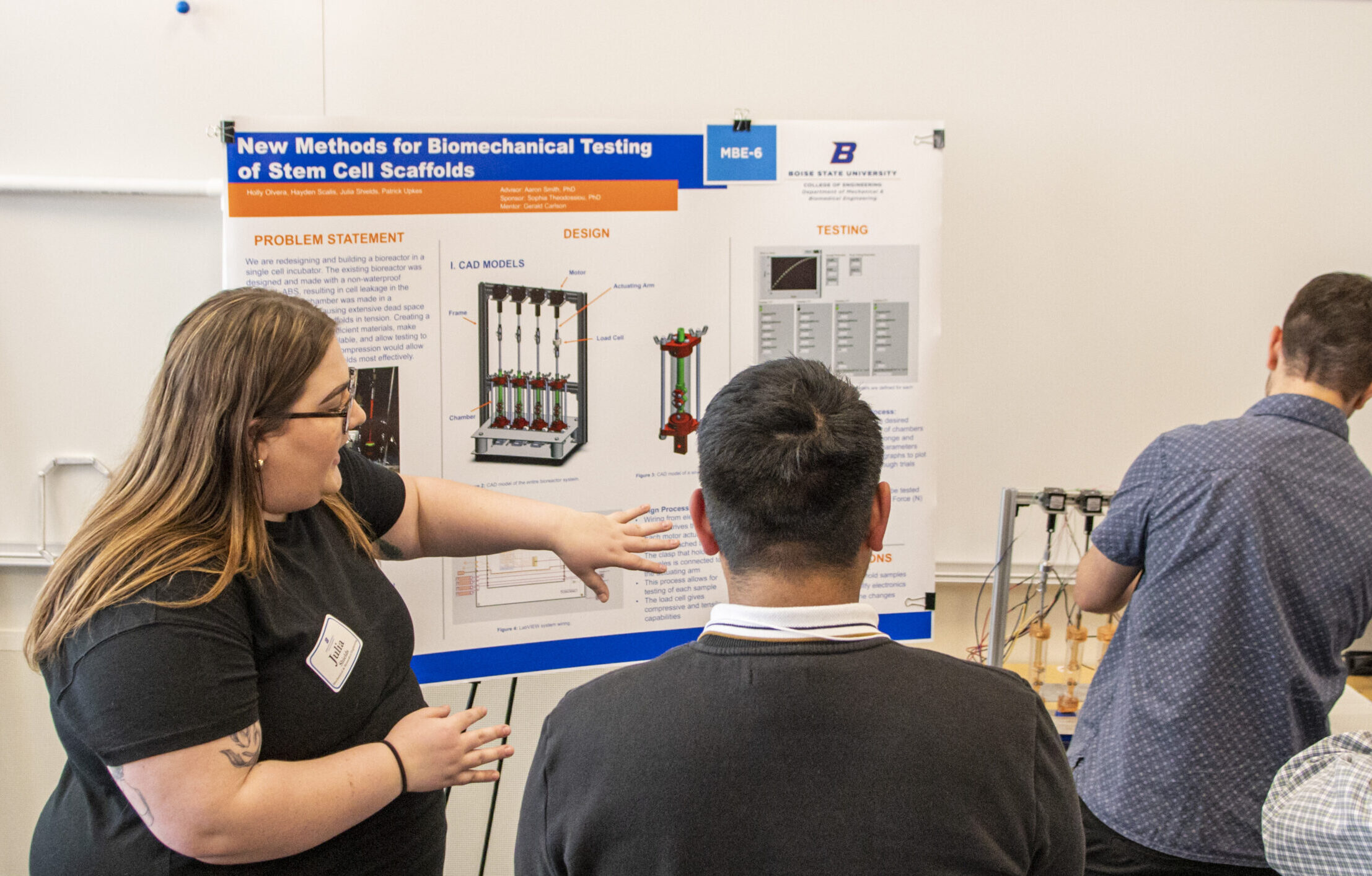 Photo of a stellar Mechanical Engineering student presenting their research poster
