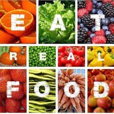 The words "Eat Real Food" over photos of different fruits and vegetables