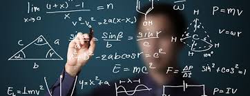 An individual is blurred behind a chalkboard, writing mathematical equations.