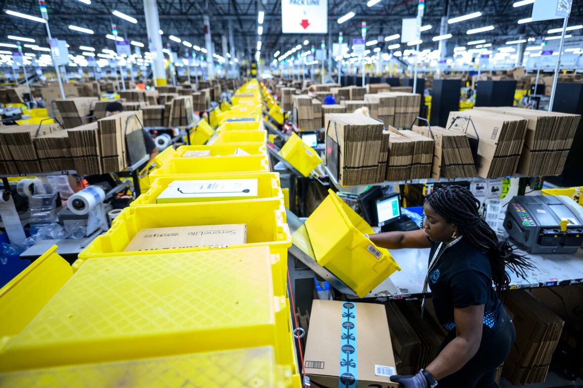 Workers in a fast-paced packaging facility.