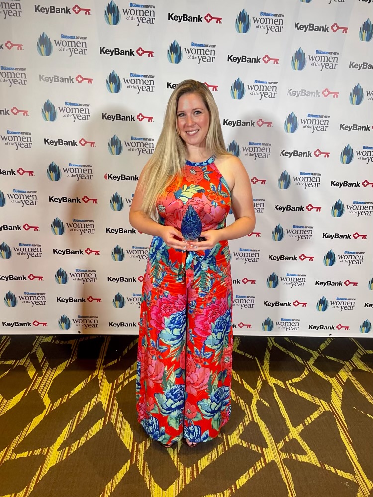 Alexis Pickering holding her award.
